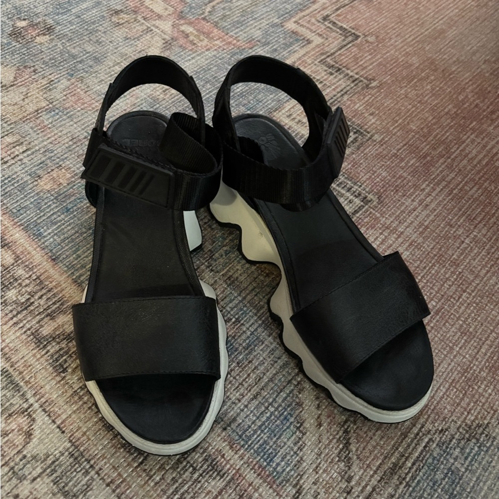 Sorel Black Platform Sandals with White Wavy Sole